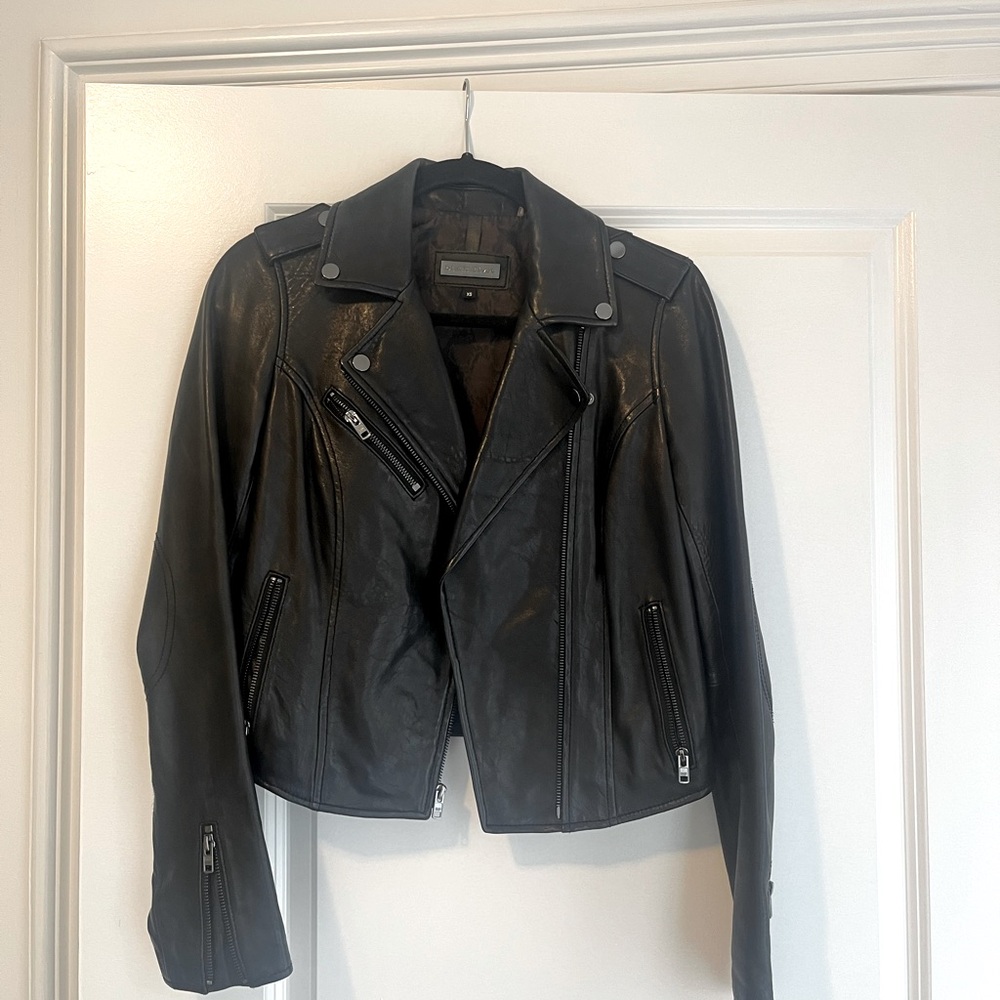 Brand new leather jacket with silver hardware. Too small never worn